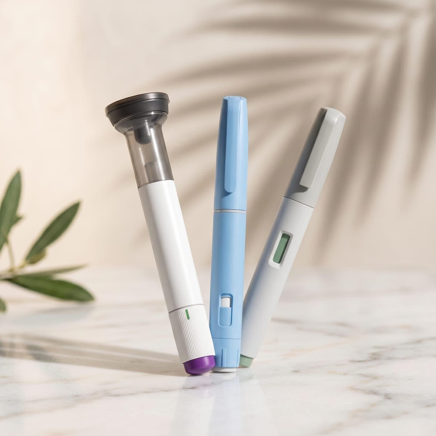 Illustration of three unbranded injection pens on a marble counter